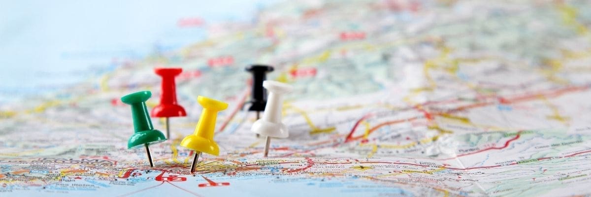 Map with colorful push pins.